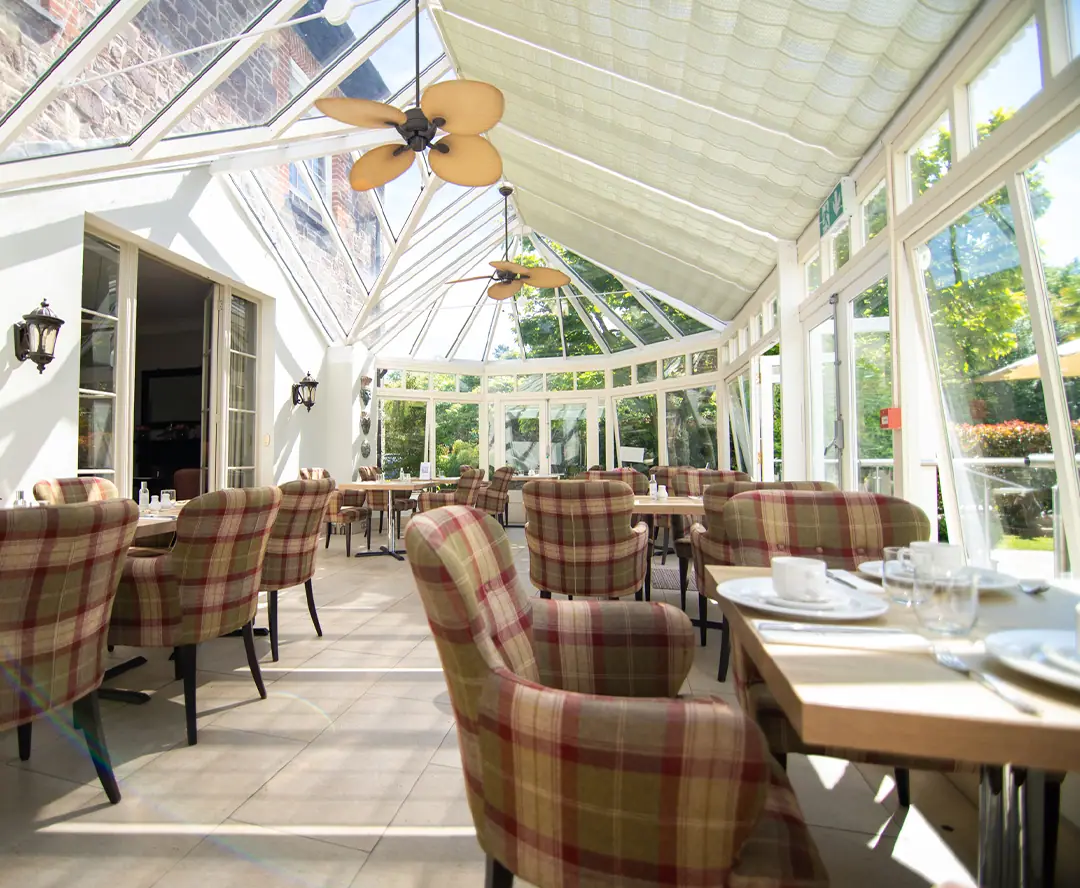 The conservatory, set for breakfast
