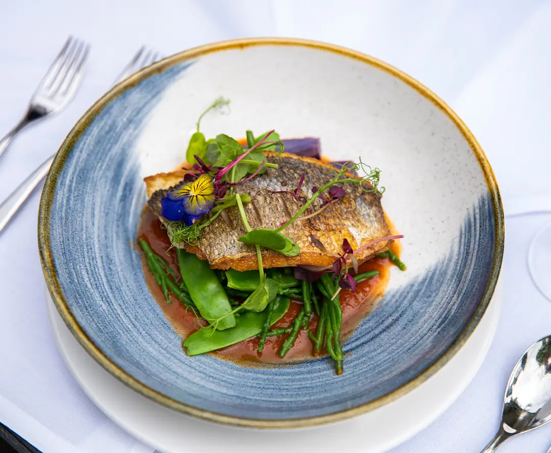 Sea bass with seasonal vegetables