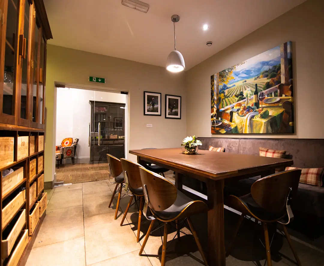 A private dining room with a long wooden table