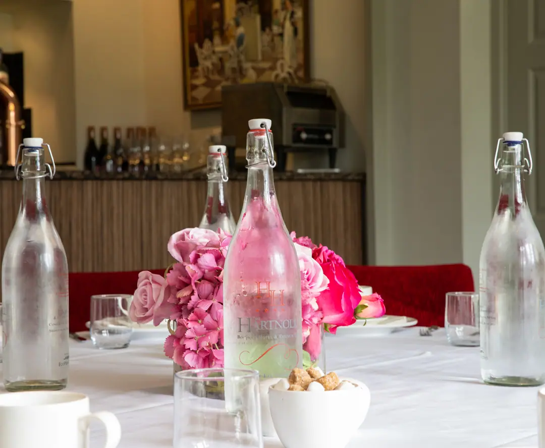 A restaurant table laid with flowers